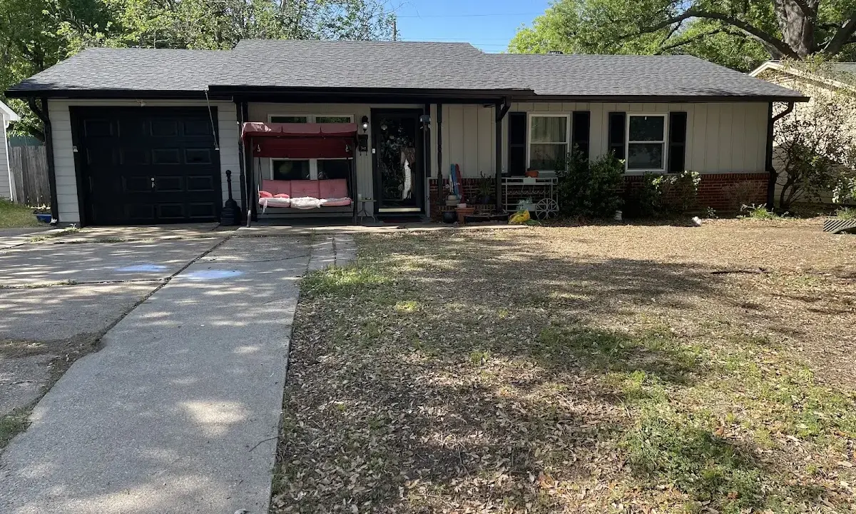 Asphalt Shingle Roof Repair crew at work on a residential roof in Clay